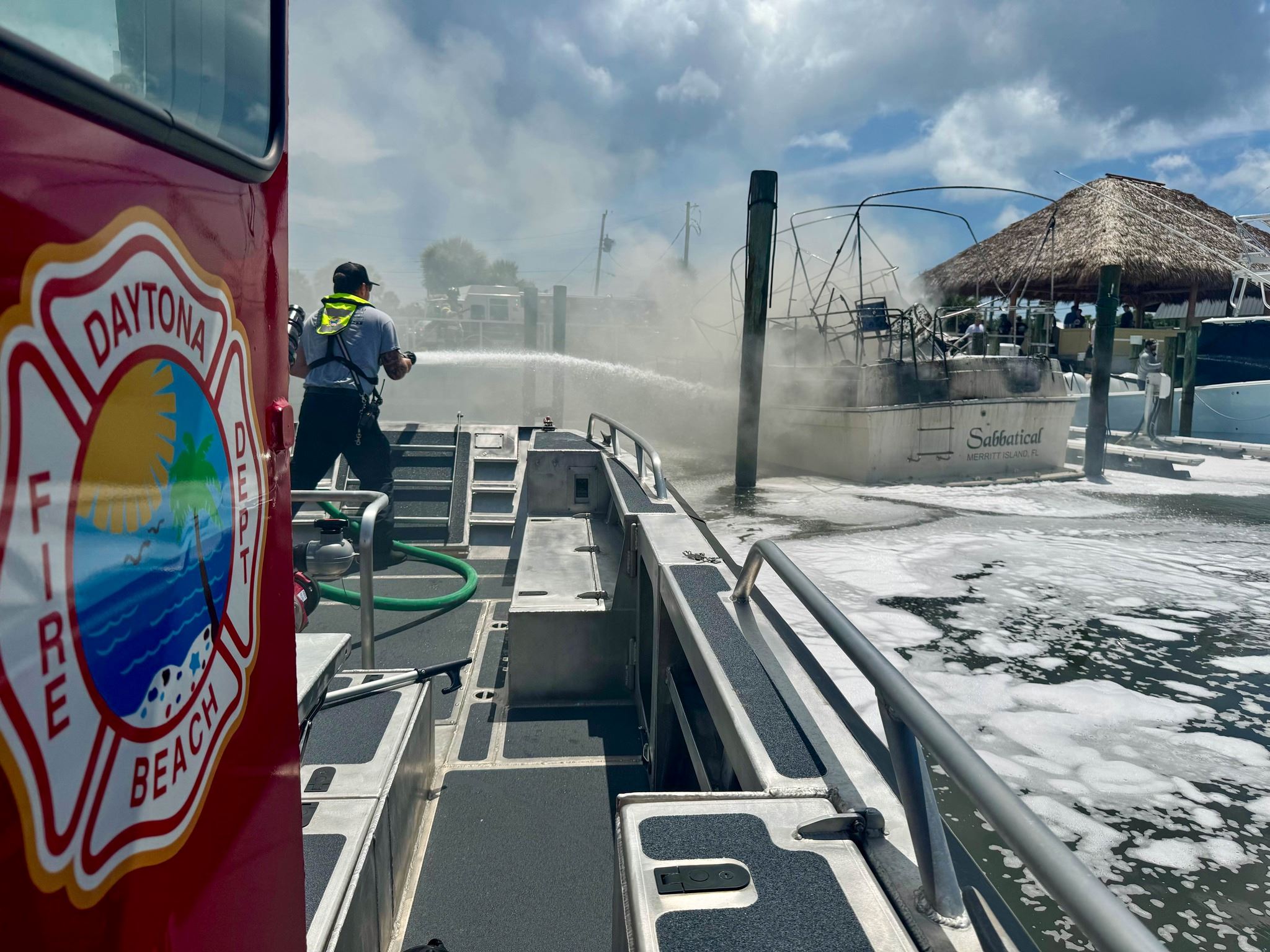 picture of firefighters extinguishing a fire from new firefighting boat